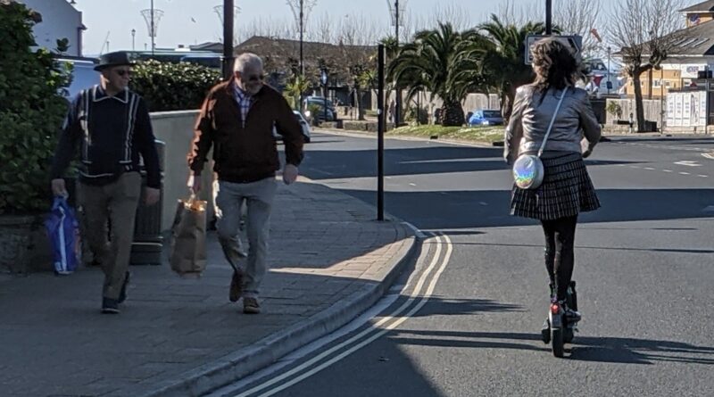 The author on an electric scooter