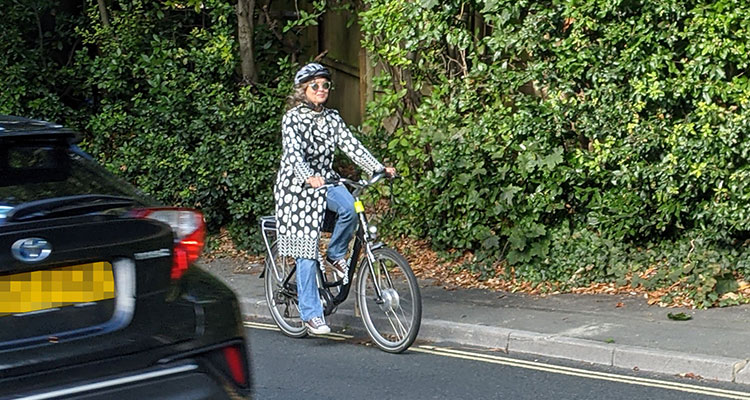 Cat James on her e-bike