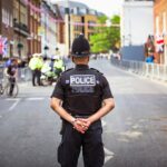 UK police officer standing in a road