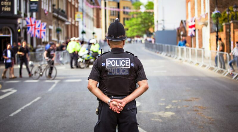 UK police officer standing in a road