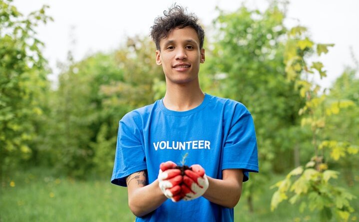 Volunteer planting a tree