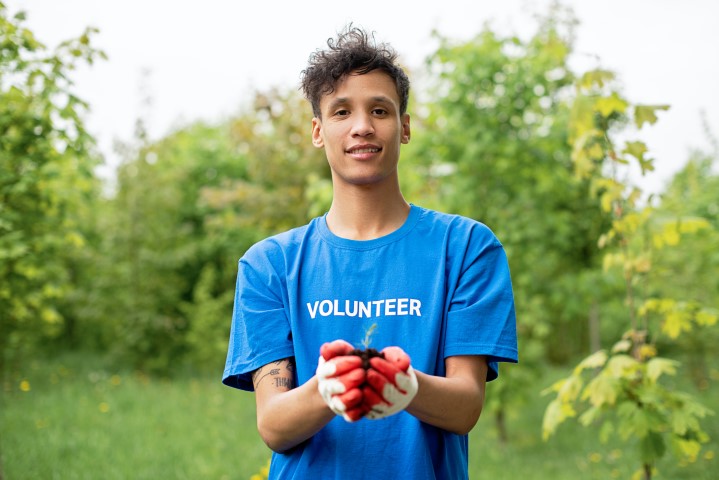 Volunteer planting a tree